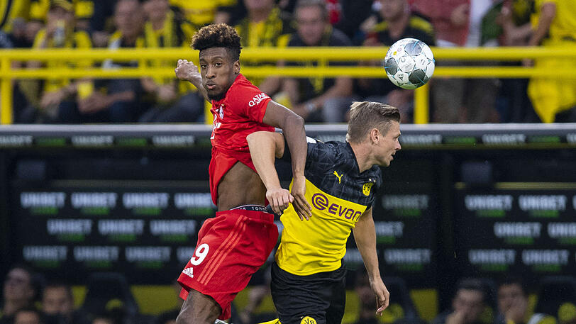 Kingsley Coman (l) gegen Dortmunds Lukasz Piszczek.