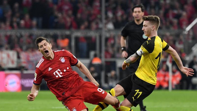 Münchens Robert Lewandowski (l.) und Marco Reus aus Dortmund kämpfen um den Ball. Foto: Sven Hoppe/Archivbild Münchens Robert Lewandowski (l.) und Marco Reus aus Dortmund kämpfen um den Ball. Foto: Sven Hoppe/Archivbild