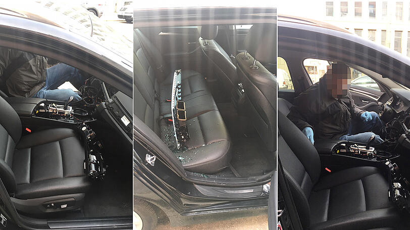 Alles weg: Sogar das Lenkrad fehlt. Ein Ermittler sichert Spuren in dem ausgeschlachteten BMW.
