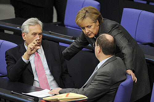 Bundeskanzlerin Angela Merkel,  Bundeswirtschaftsminister Michael Glos und Bundesfinanzminister Peer Steinbrück