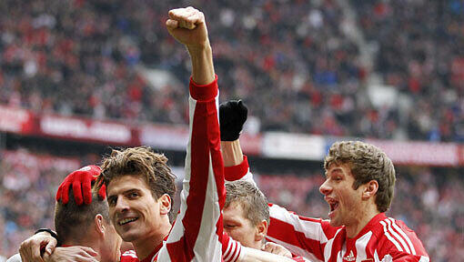 Jubelnde Spieler des FC Bayern München - rechts im Bild Thomas Müller. Jubelnde Spieler des FC Bayern München - rechts im Bild Thomas Müller.