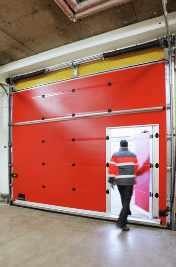 ASSA ABLOY Entrance Systems stellt Sektionaltore für Feuerwehrhäuser her.