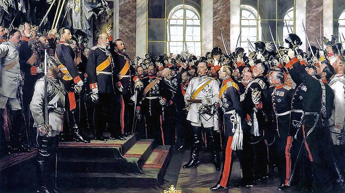 Reichsgründung ohne den bayerischen König: Das Gemälde des Historienmalers Anton von Werner zeigt das Hoch des Großherzogs von Baden auf den neuen Kaiser. Auf dem Podium hinter Wilhelm I. stehen die Bundesfürsten, davor Offiziere und der Kanzler Otto von Bismarck (in weißer Uniform).