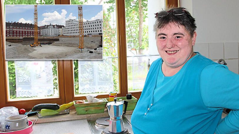 Blick in den grünen Garten, Ruhe &ndash; und das alles für viel weniger Geld als in München: Karin S. in ihrer Küche der neuen Wohnung in Bad Füssing. Links oben: Diese Paulaner-Baustelle hat sie aus ihrer alten Wohnung vertrieben.