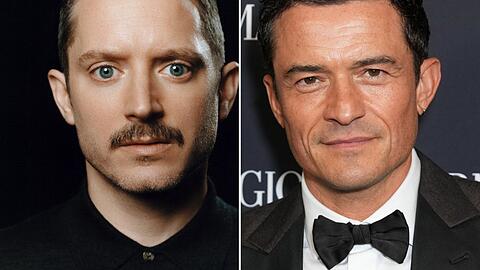 Elijah Wood (l.) und Orlando Bloom werden Teil der Netflix-Serie "The Gentlemen".