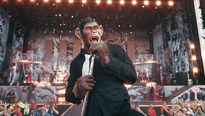 Robbie Williams im Film ""Better Man -Die Robbie Williams Story" bei einem Live-Konzert. Robbie Williams im Film ""Better Man -Die Robbie Williams Story" bei einem Live-Konzert.