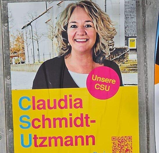 Ein Wahlplakat von Claudia Schmidt-Utzmann in Oberhaching.
