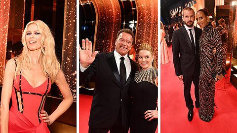Claudia Schiffer glänzt in einem roten Kleid. Arnold Schwarzenegger gibt den Strahlemann. Die Bilder vom roten Teppich des 69. Bambi in Berlin.