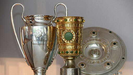 Triple aus DFB-Pokal, Meisterschale und Champion League-Pokal. Triple aus DFB-Pokal, Meisterschale und Champion League-Pokal.