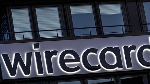 Der Schriftzug von Wirecard ist an der Firmenzentrale des Zahlungsdienstleisters in Aschbeim bei München zu sehen. Foto: Peter Kneffel/dpa/Archivbild