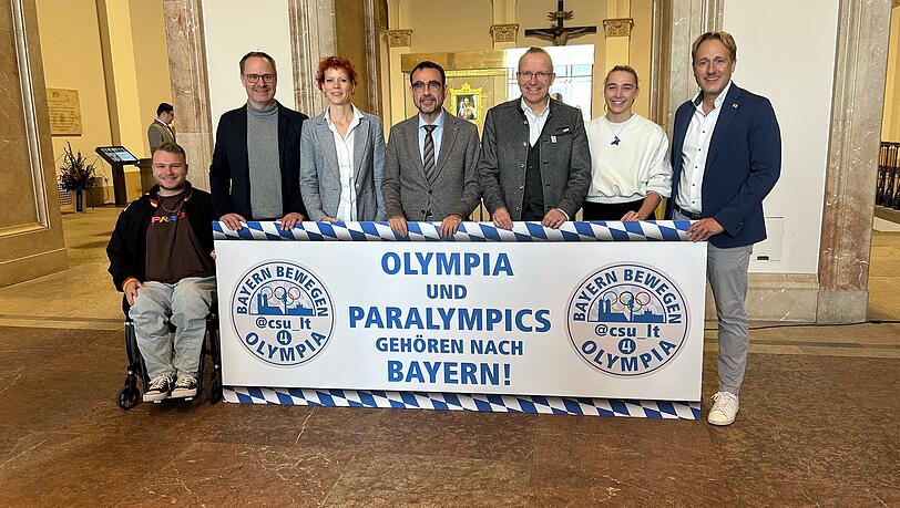 Ein Bündnis pro Olympia: v.l. Nicolai Sommer, Thomas Freudenberger (CSU, Landesportbeirat), Susanne Burger (Geschäftsführerin des BLSV), Klaus Holetschek (CSU Fraktionsvorsitzender im Landtag), Jörg Ammon (BLSV-Präsident), Mona Mayer (400-Meter-Läuferin) und Martin Stock (Landtagsabgeordneter und Sportpolitischer Sprecher der CSU). Ein Bündnis pro Olympia: v.l. Nicolai Sommer, Thomas Freudenberger (CSU, Landesportbeirat), Susanne Burger (Geschäftsführerin des BLSV), Klaus Holetschek (CSU Fraktionsvorsitzender im Landtag), Jörg Ammon (BLSV-Präsident), Mona Mayer (400-Meter-Läuferin) und Martin Stock (Landtagsabgeordneter und Sportpolitischer Sprecher der CSU).