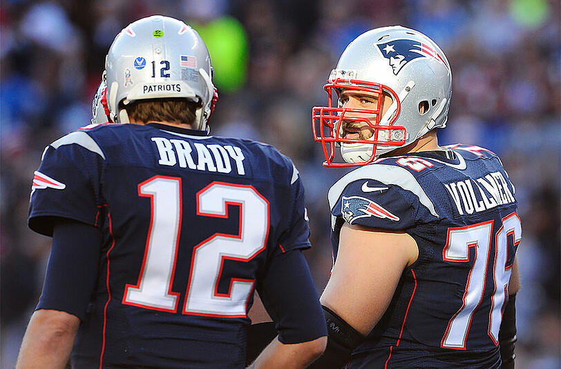 Vollmer (r.) im Gespräch mit Quarterback-Pionier Tom Brady.