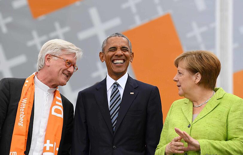 Ratsvorsitzende der Evangelischen Kirche, Heinrich Bedford-Strohm, Ex-US-Präsident Barack Obama und Kanzlerin Angela Merkel