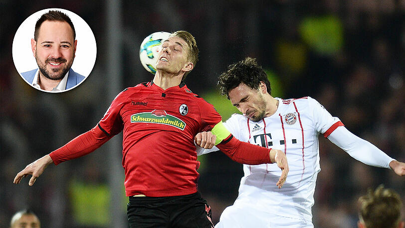 Stürmer und Verteidiger im Duell: Nils Petersen (li.) vom SC Freiburg und Mats Hummels vom FC Bayern.