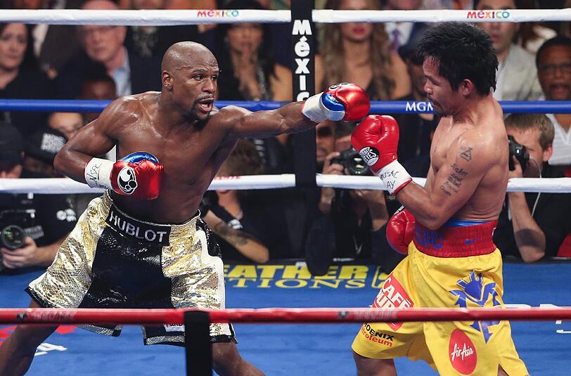Floyd Mayweather hat den Angriff von Manny Pacquiao im Rekord-Boxkampf erfolgreich abgewehrt und bleibt auch in seinem 48. Profi-Duell ungeschlagen. Der Fight in Bildern.