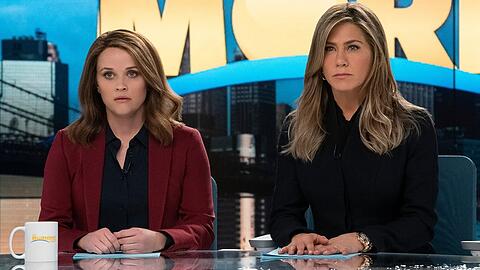 Reese Witherspoon (l.) und Jennifer Aniston bleiben dem Frühstücksfernsehen erhalten.