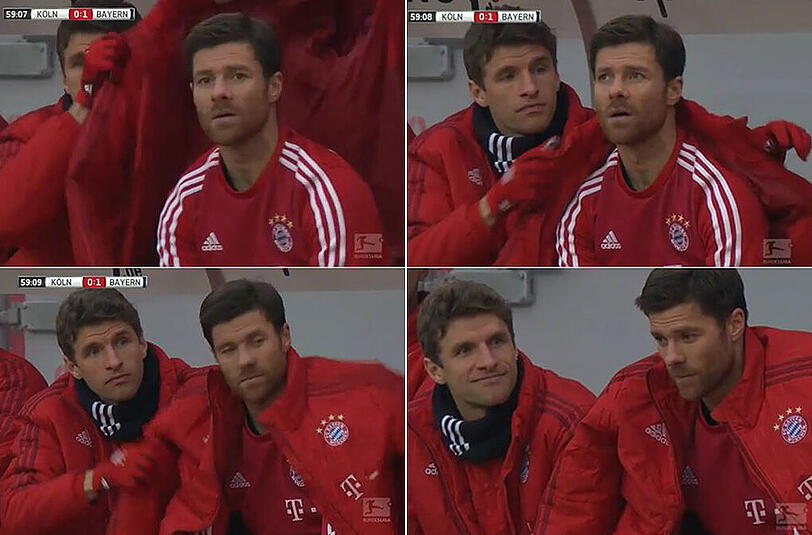 So sieht Teamkollegen-Liebe aus: Thomas Müller (links) schnappt sich die warme Jacke und legt sie dem soeben ausgewechselten Xabi Alonso über die Schulter.