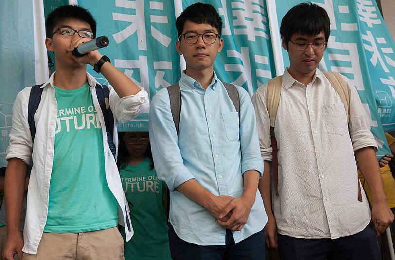 Joshua Wong (l.), Nathan Law (m.) und Alex Chow (r.). Foto: Alex Hofford