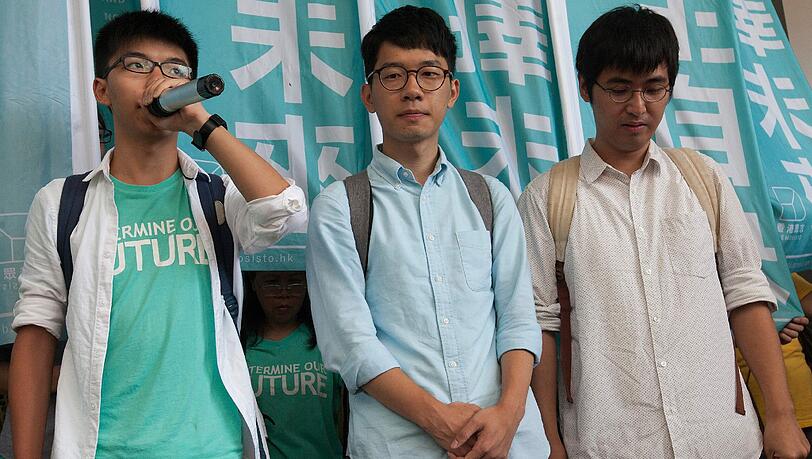 Joshua Wong (l.), Nathan Law (m.) und Alex Chow (r.). Foto: Alex Hofford Joshua Wong (l.), Nathan Law (m.) und Alex Chow (r.). Foto: Alex Hofford