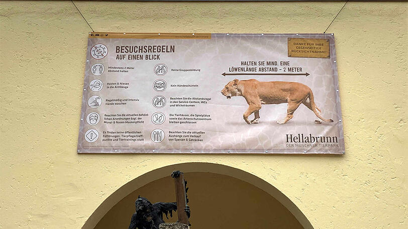 "Halten Sie mindestens eine Löwenlänge Abstand": Besucher-Hinweise im Tierpark Hellabrunn.