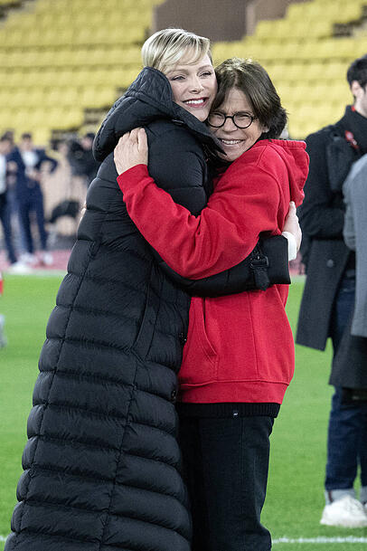 Warm hug: Princess Charlene and Princess Stephanie of Monaco