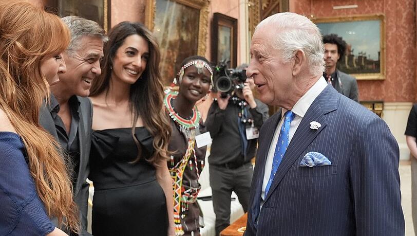 George und Amal Clooney bei ihrem Wiedersehen mit König Charles.