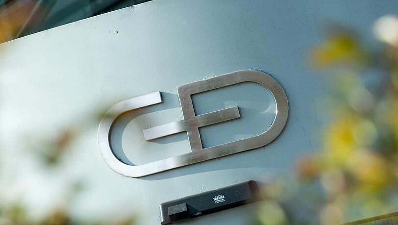 Das Firmenlogo am Gebäude der Zentrale von Giesecke & Devrient. (Symbolbild) Das Firmenlogo am Gebäude der Zentrale von Giesecke & Devrient. (Symbolbild)