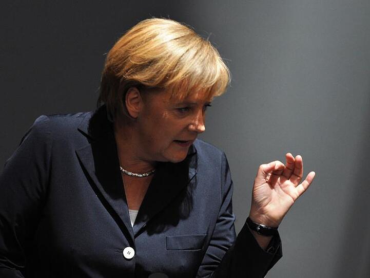 "Wir sind gewählt worden zu reagieren", sagt Kanzlerin Merkel - es klingt wie eine Drohung.