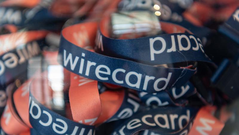 Umhängebändchen mit der Aufschrift "wirecard". Foto: Peter Kneffel/dpa/Archivbild Umhängebändchen mit der Aufschrift "wirecard". Foto: Peter Kneffel/dpa/Archivbild