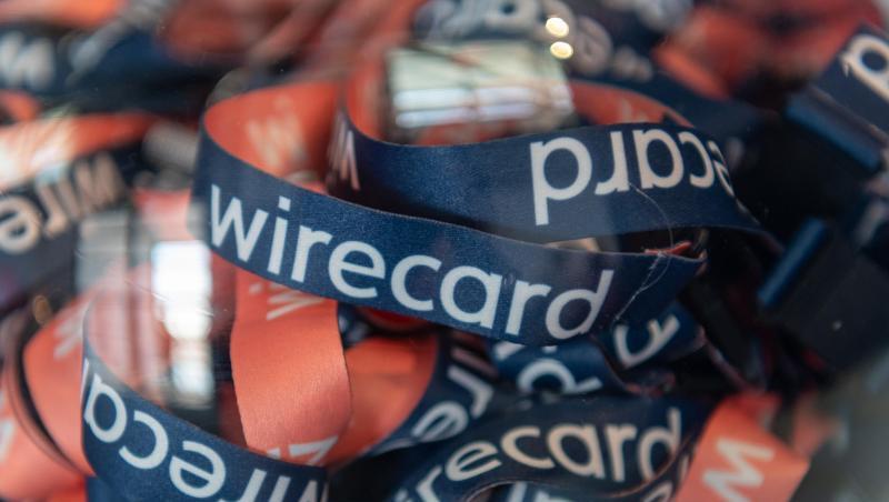 Umhängebändchen mit der Aufschrift "wirecard" liegen in einem Glasbehälter. Foto: Peter Kneffel/dpa/Archivbild Umhängebändchen mit der Aufschrift "wirecard" liegen in einem Glasbehälter. Foto: Peter Kneffel/dpa/Archivbild
