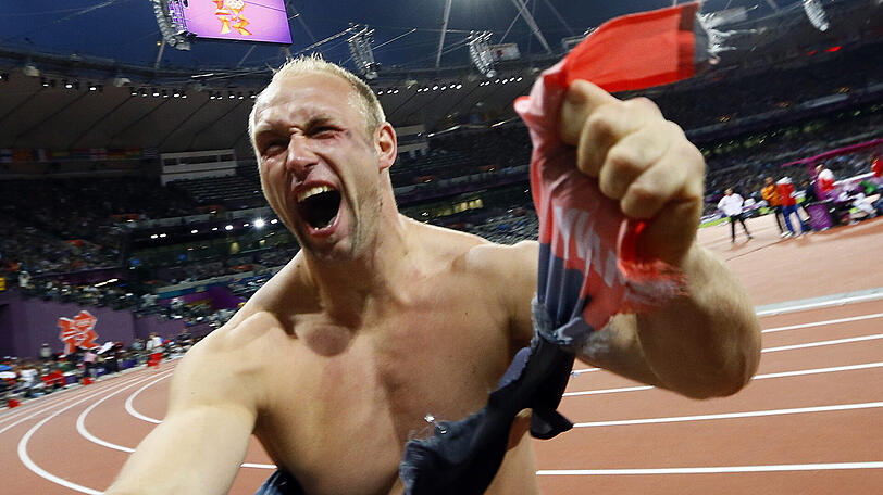 Robert Harting jubelt über sein Olympia-Gold in London.
