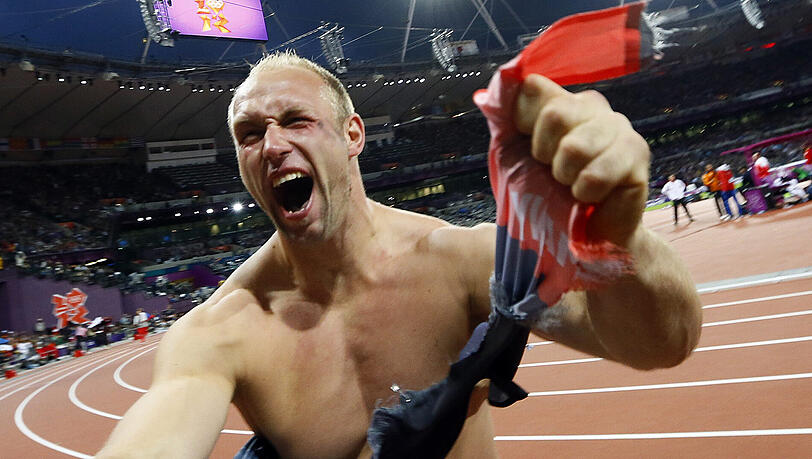 Robert Harting jubelt über sein Olympia-Gold in London. Robert Harting jubelt über sein Olympia-Gold in London.