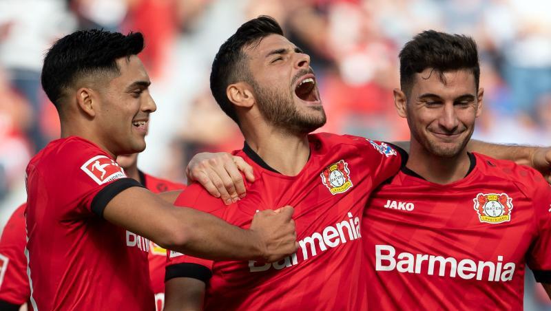 Torschütze Kevin Volland (M) jubelt mit Nadiem Amiri (l) und Lucas Alario (r) über das 1:0 gegen Union Berlin. Torschütze Kevin Volland (M) jubelt mit Nadiem Amiri (l) und Lucas Alario (r) über das 1:0 gegen Union Berlin.
