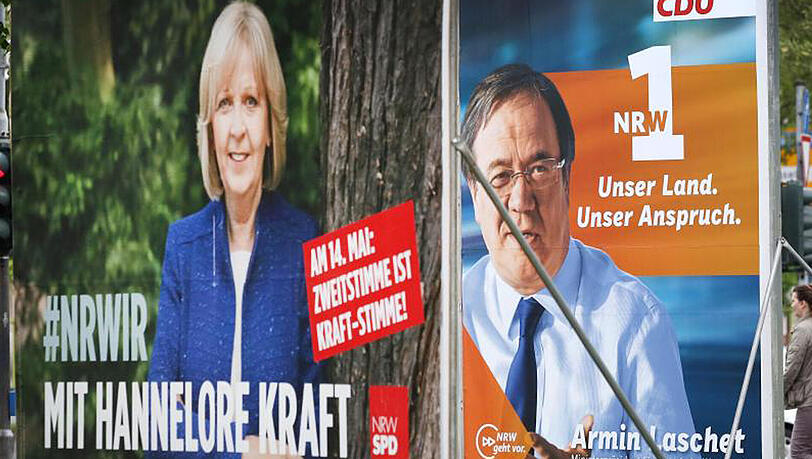 Wahlplakate der nordrhein-westfälischen Ministerpräsidentin Hannelore Kraft und des CDU-Spitzenkandidaten Armin Laschet in Düsseldorf. Wahlplakate der nordrhein-westfälischen Ministerpräsidentin Hannelore Kraft und des CDU-Spitzenkandidaten Armin Laschet in Düsseldorf.