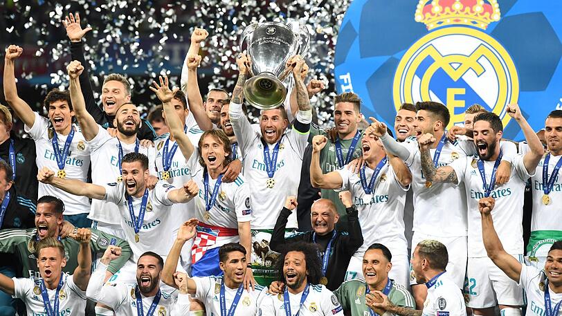 Die Fußball-Könige der Welt: Real um Kapitän Sergio Ramos (mit Pokal) feiert den 3:1-Sieg im Champions-League-Finale über den FC Liverpool, der Madrid den 13. Titel in der Königsklasse beschert.