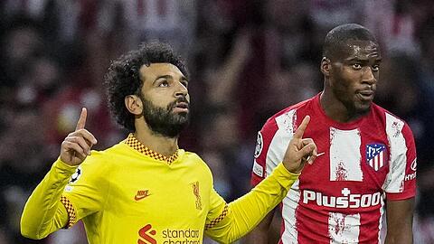 Mohamed Salah (l) sorgte für Liverpools Siegtreffer bei Atlético Madrid.