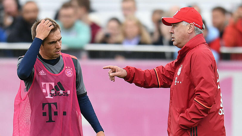 Kapitän Philipp Lahm (l.) hört am Ende der Saison auf, für Trainer Carlo Ancelotti ist das allerdings "ein Problem für die nächste Saison".