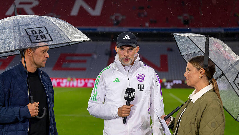 Nach dem 3:1-Sieg über den FC Augsburg lieferte sich Thomas Tuchel (m.) ein handfestes verbales Gefecht mit DAZN-Moderatorin Laura Wontorra (r.) und Experte Michael Ballack (m.) Nach dem 3:1-Sieg über den FC Augsburg lieferte sich Thomas Tuchel (m.) ein handfestes verbales Gefecht mit DAZN-Moderatorin Laura Wontorra (r.) und Experte Michael Ballack (m.)