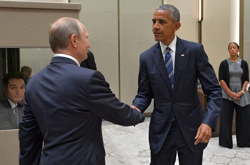 Die mächtigsten Männer der Welt beim Handshake: Wladimir Putin begrüßt US-Präsident Barack Obama beim G20-Gipfel in Hangzhou. Foto: Alexei Druzhinin