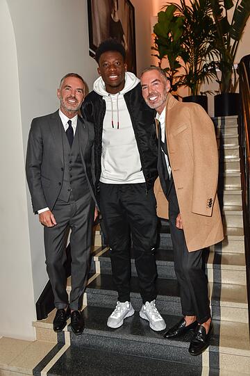 Dean und Dan Caten mit Alphonso Davies