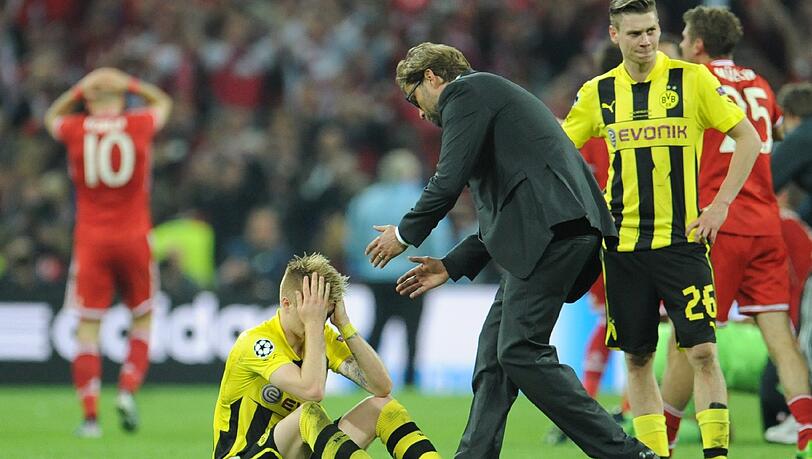 Enttäuschte Dortmunder nach dem verlorenen Champions-League-Finale gegen den FC Bayern. Enttäuschte Dortmunder nach dem verlorenen Champions-League-Finale gegen den FC Bayern.