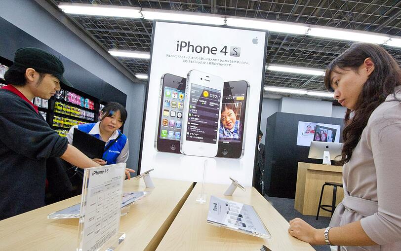 Auch in Asien: das Warten und die Freude über das neue iPhone.