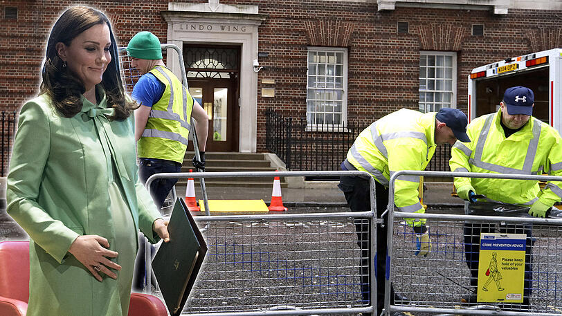 Vorbereitungen vor dem St. Mary's Hospital in London: Arbeiter errichten Absperrgitter.