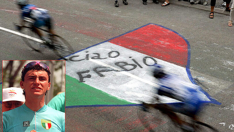 Die Tour rollt weiter: Rennfahrer rasen auf einer Etappe der Tour de France im Jahr 2005 über eine Pflastermalererei zum Gedenken an den Italiener Fabio Casartelli. Die Tour rollt weiter: Rennfahrer rasen auf einer Etappe der Tour de France im Jahr 2005 über eine Pflastermalererei zum Gedenken an den Italiener Fabio Casartelli.