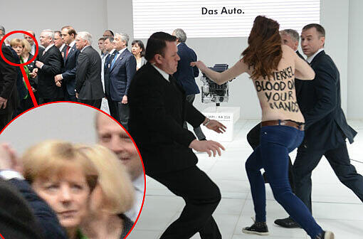 Huch! Was ist denn da los? Bundeskanzlerin Merkel sichtilich irritiert, als die Aktivistin mit nacktem Oberkörper auf die Delegation zustürmt...