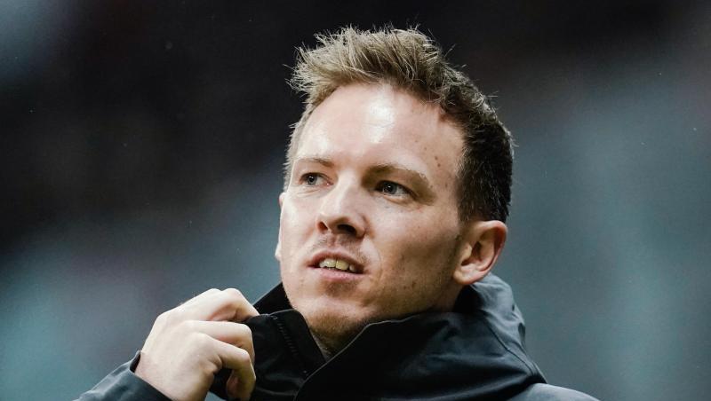 Leipzigs Trainer Julian Nagelsmann kommt zu Spielbeginn ins Stadion. Foto: Uwe Anspach/dpa Leipzigs Trainer Julian Nagelsmann kommt zu Spielbeginn ins Stadion. Foto: Uwe Anspach/dpa