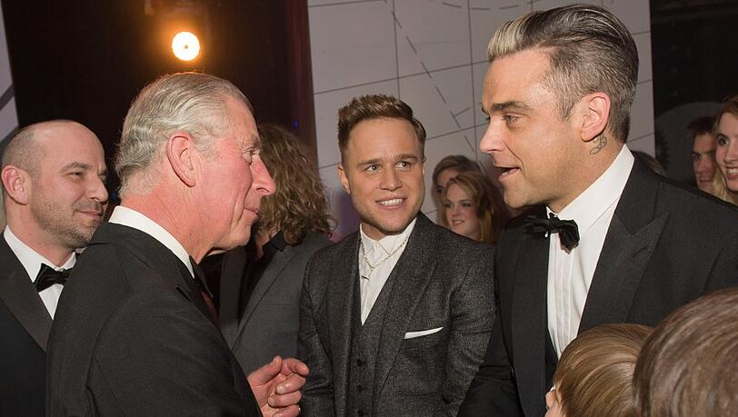 Charles und Robbie Williams bei einer Begegnung im Jahr 2013.