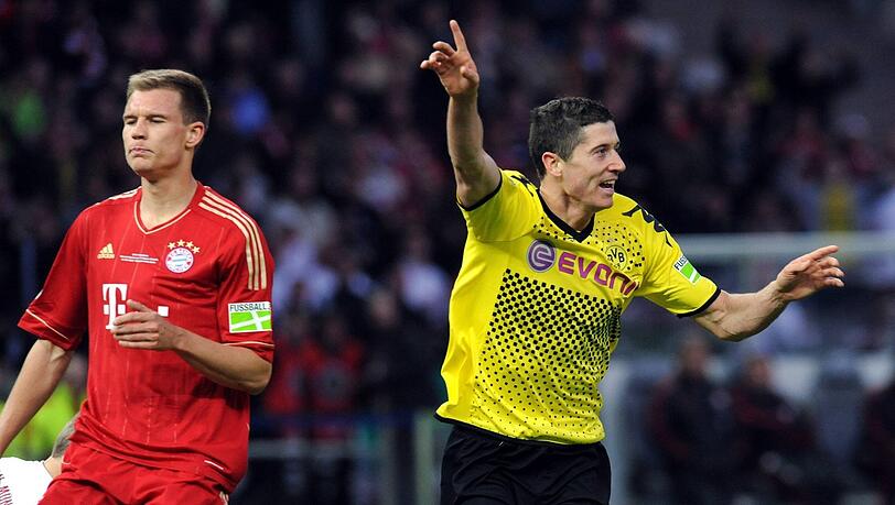Vor dem "Drama dahoam" kommt es aus bayerischer Sicht zum "Drama in Berlin": Robert Lewandowski (r.) schenkt den Münchnern drei Stück ein.