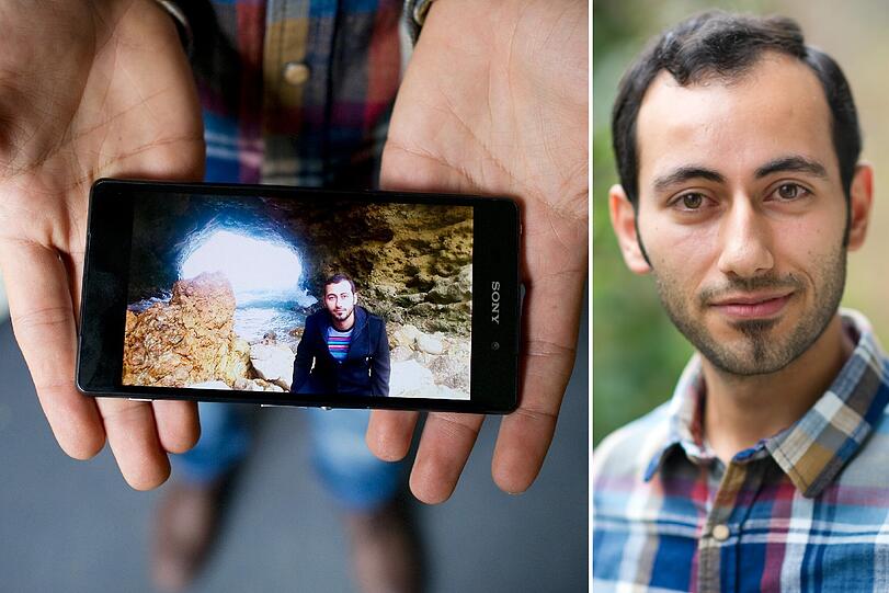 Wajih (29) aus Damaskus in Syrien zeigt ein Foto von seinem Zufluchtsort am Meer.