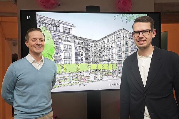 Christian Bosiljanoff (l.), der Chef von Pembroke Deutschland, mit Projektleiter Thomas Spitzer. Sie stehen vor einer Zeichnung, die zeigt, wie der geplante Neubau mal ausschauen soll.